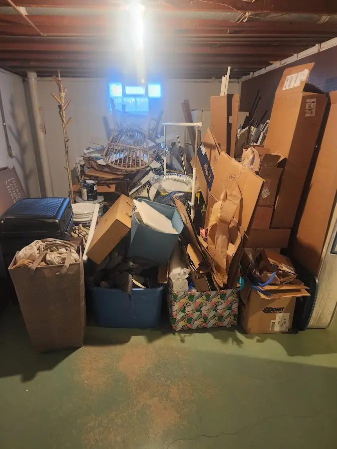 Roll-off dumpster container at job site for 2 Yard Dumpster Rental in Higginsville